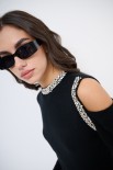 MAGLIA CUT OUT CON STRASS NERO