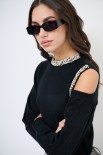 MAGLIA CUT OUT CON STRASS NERO