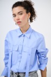 CAMICIA CON TASCHE CELESTE