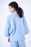 GIACCA OVERSIZE CON SPILLA BLU CHIARO