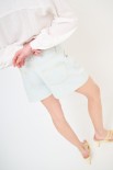 SHORTS CON RISVOLTO CREMA