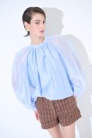BLUSA CON FIOCCO DIETRO CELESTE