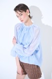 BLUSA CON FIOCCO DIETRO CELESTE