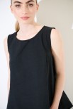 TOP SMANICATO CON BOTTONI DIETRO NERO