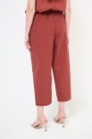 PANTALONE CARROT CON TASCA NELLA CUCITURA BRUCIATO