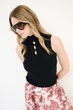 TOP SMANICATO COSTINA CON BUCHI NERO