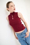 TOP SMANICATO COSTINA CON BUCHI BORDEAUX