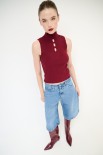 TOP SMANICATO COSTINA CON BUCHI BORDEAUX