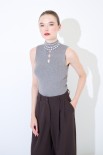 TOP SMANICATO COSTINA CON BUCHI GRIGIO