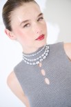TOP SMANICATO COSTINA CON BUCHI GRIGIO