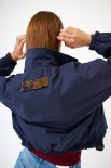 BOMBER CORTO CON INSERTI JACQUARD BLU