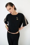 BLUSA OVER CON BANDE + SPILLA NERO