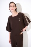 BLUSA OVER CON BANDE + SPILLA MORO