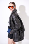 SHEARLING MIDI CON BOTTONE FODERATO NERO