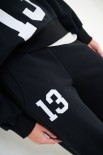 PANTALONE FELPA CON STAMPA SOTTO TASCA NERO