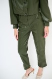 PANTALONE ECOPELLE CON TASCHE DAVANTI MILITARE
