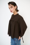 BLUSA CON BRACCIALI MANICHE MORO