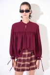 BLUSA CON BRACCIALI MANICHE VINO