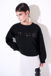 FELPA GARZATA CON SPACCHI SCRITTA PAILLETTES NERO