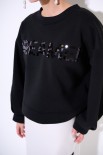 FELPA GARZATA CON SPACCHI SCRITTA PAILLETTES NERO