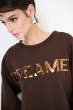 FELPA GARZATA CON SPACCHI SCRITTA PAILLETTES MORO