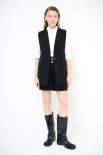 GILET LUNGO CON FILETTO E PATTINE NERO