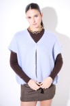 PONCHO CON BOTTONE MOHAIR CELESTE